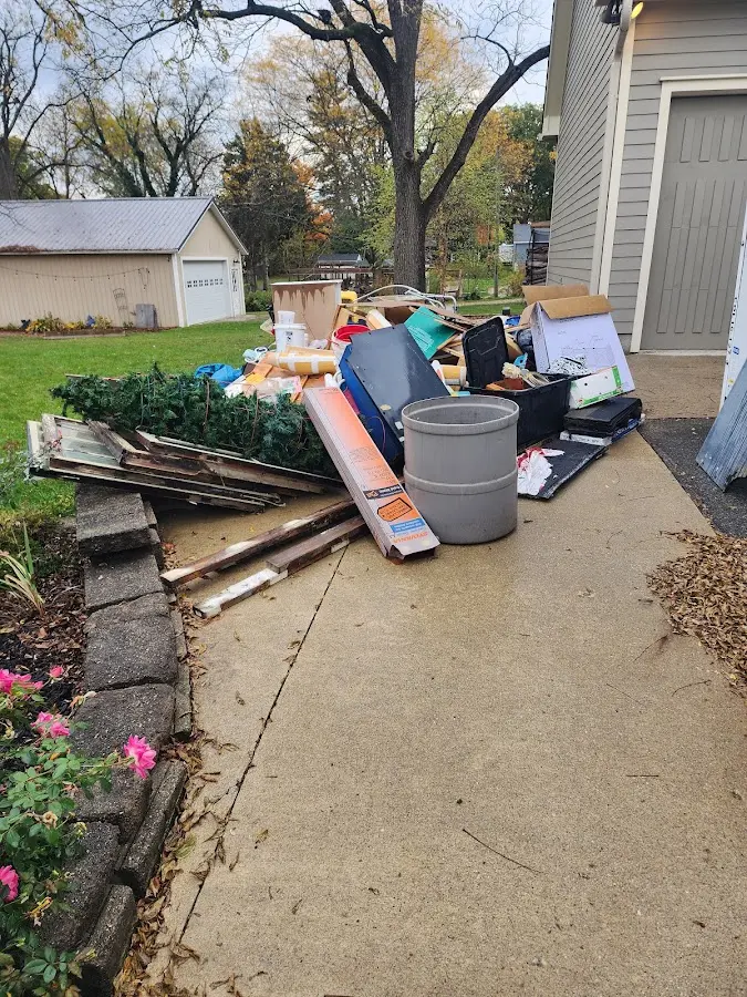Dumpster being loaded with debris for Residential Dumpster Rental in Westchase
